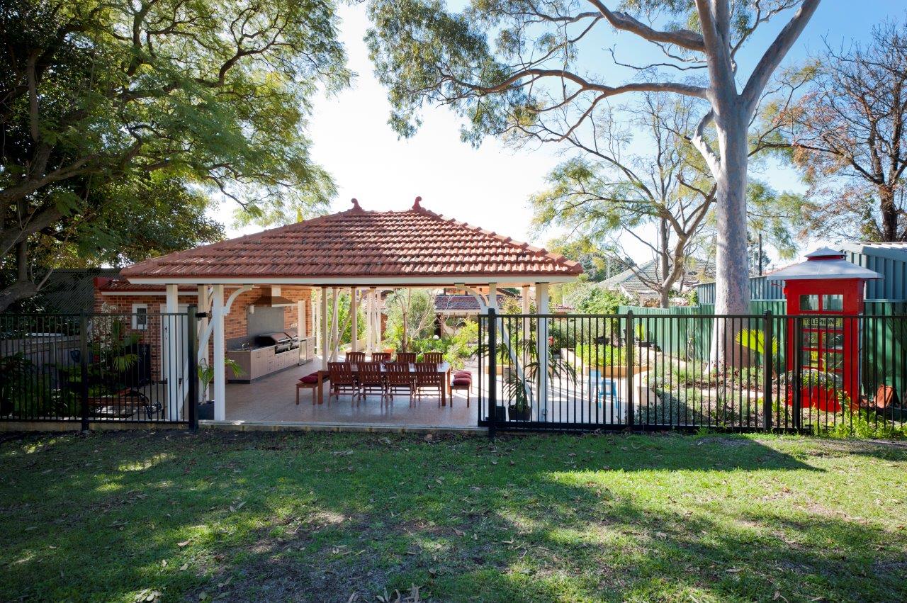 backyard patio setting with a london telephone box