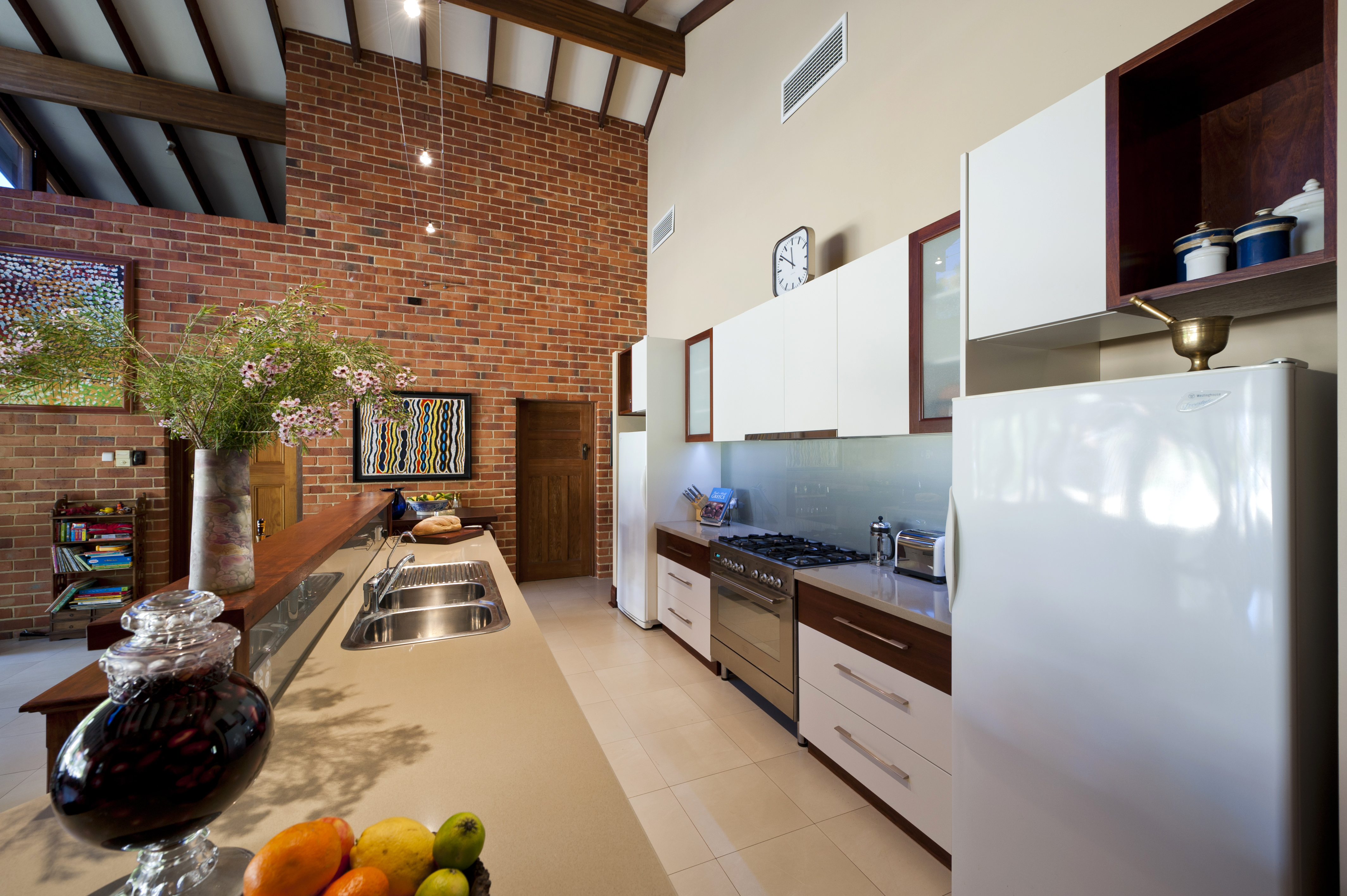 brick wall high ceilings kitchen