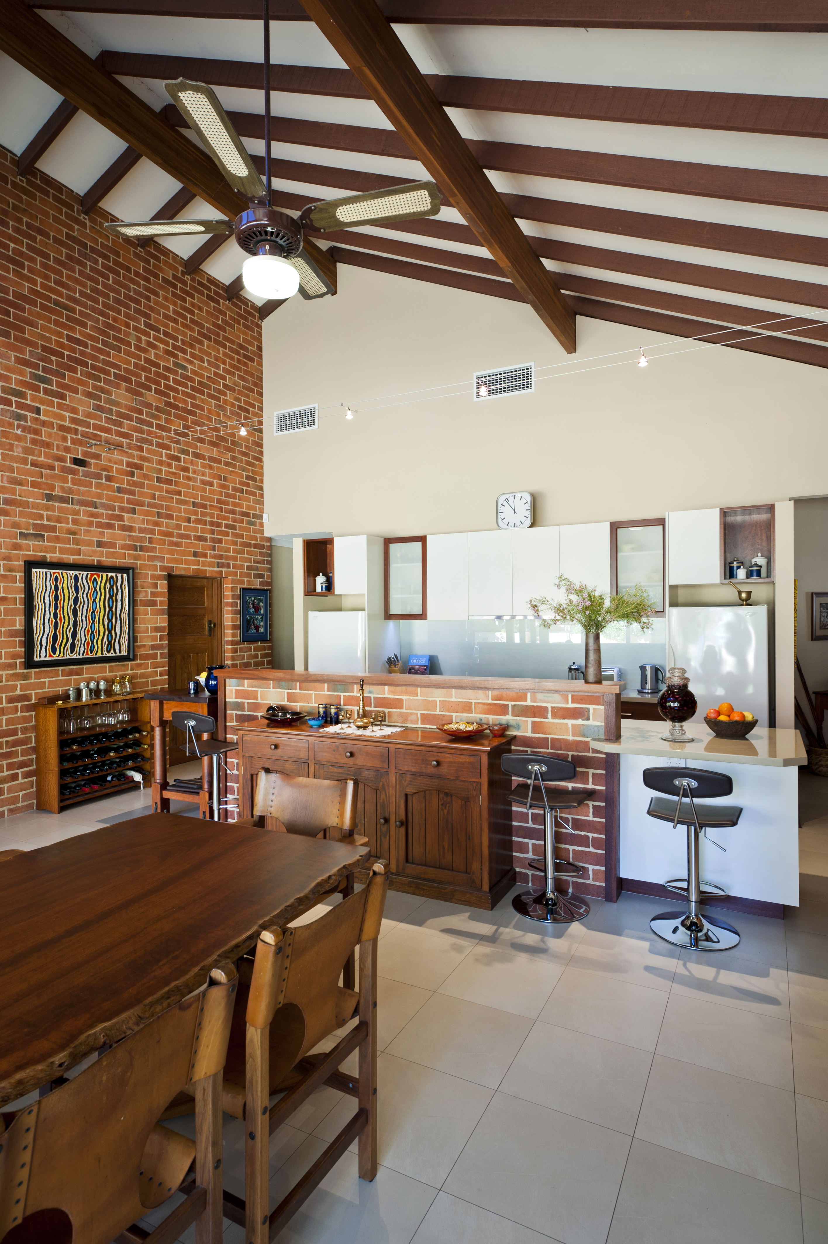 brick wall kitchen dining table high ceilings