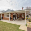 brick veneer home backyard